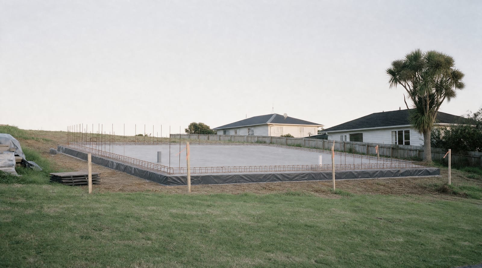 Poured concrete slab with reinforcing and formwork