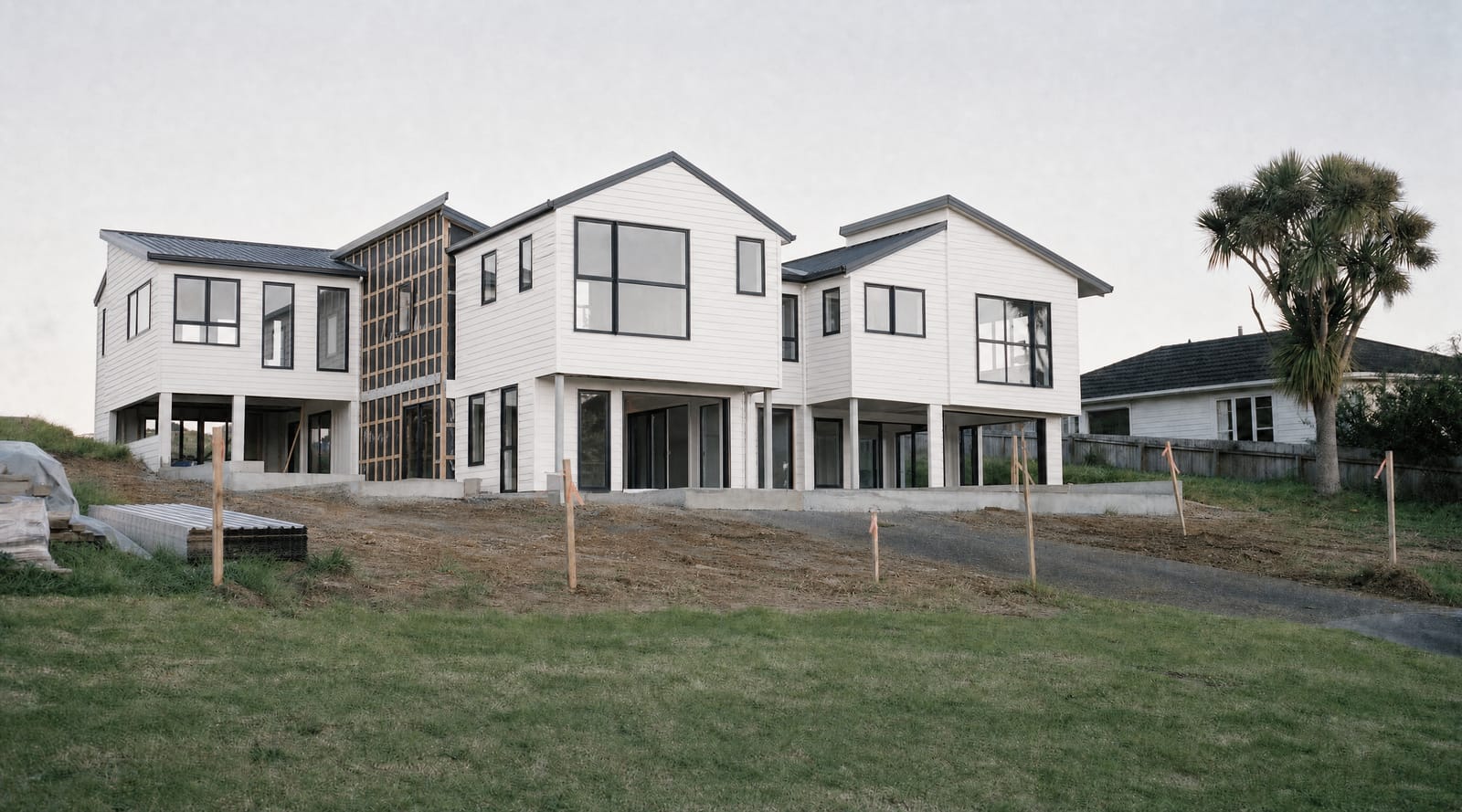 Homes roofed, wrapped and partially clad